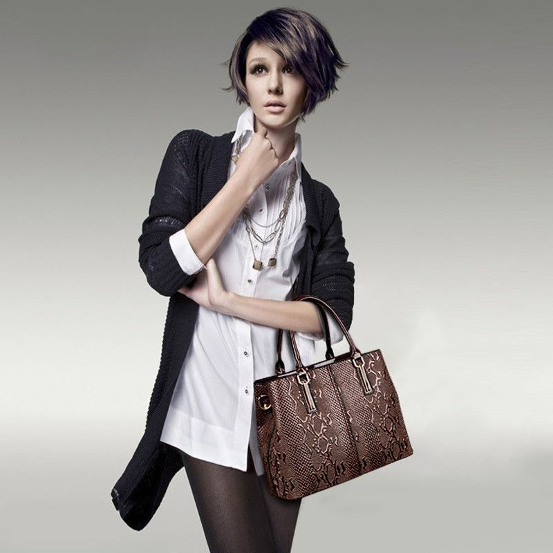 Leather snake-pattern handbag