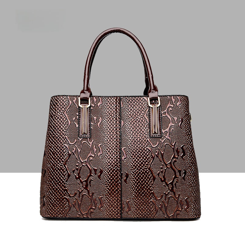 Leather snake-pattern handbag